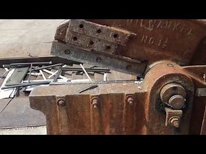 Giant metal shears at scrap yard cutting metal!