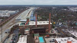 Aerial of Atlanta Cabbagetown community housing and Intown neighbourhood, Fulton Cotton Mill Lofts and massive shipping Yard facility, Georgia, USA