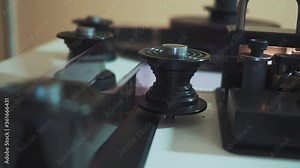 Old movie film strip. scanner is scanning 35 mm film to digital close up. Restoration of an old movie. History.