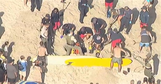 Watch: Crews dig out girl who got stuck in sand at San Diego beach