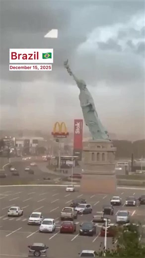 @world_climat_news_2025 on Instagram: "December 15, 2025 Rio Grande do Sul, Brazil A powerful storm with winds up to 90 km/h (56 mph) toppled a 24-meter-tall replica of the Statue of Liberty in front of the Havan store in Guaiba. Authorities issued emergency warnings as storm surges, hail, flooding, and roof damage affected other areas of Rio Grande do Sul. Twenty-eight municipalities reported damage from the storm. Fallen trees and hail were reported, and the storm’s winds ripped off roofs and