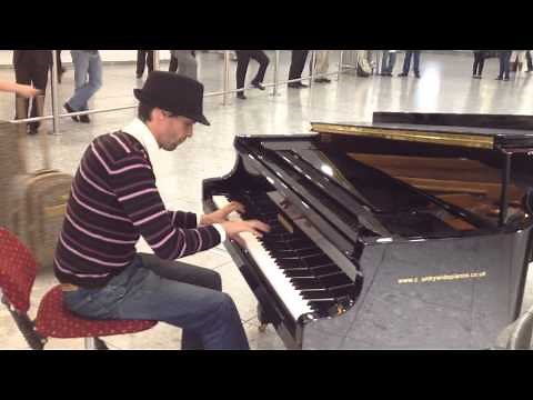 Amazing pianist at Heathrow airport arrivals hall