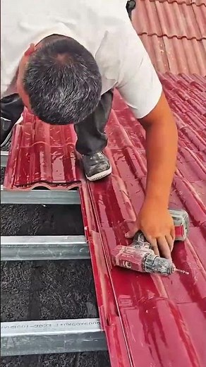 installing red metal roofing sheets #roofing #construction