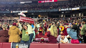 President Trumo presiding over an enlistment ceremony of new US troops at the Commanders’ game.
