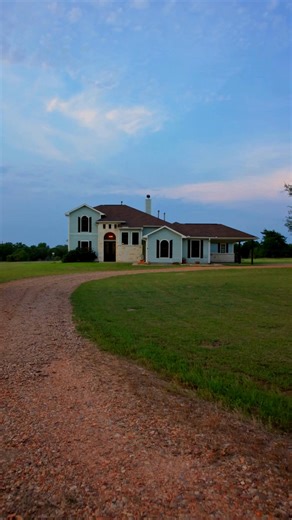 14450 Hartstack Rd | CARMINE Tucked away in the countryside of Washington County, this 28-acre property offers the best of Texas living. The 4 BD/3.5 BA main house has an open-concept floorplan, which is ideal for both intimate family life and grand-scale entertaining. Its chef’s kitchen features premium appliances, a generous island, and custom cabinetry. The primary suite is a true retreat, complete with a spa-inspired ensuite bathroom, walk-in closet, and private access to the covered veranda