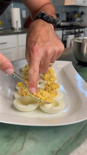Mama’s Cajun Deviled Eggs are the perfect holiday appetizer!🥚🌶️🎄 Ingredients: -6 boiled eggs -2 slices bacon, cooked crispy & diced -¼ cup mayonnaise - 1 ½ tsp sweet pickle relish -1 tsp Dijon mustard -¼ tsp Slap Ya Mama Pepper Sauce -Slap Ya Mama Seasoning, to taste -Paprika Directions: With a knife, carefully half each egg, remove yolk to a large bowl and set egg whites aside. In the large bowl, combine yolks, mayonnaise, relish, mustard and Slap Ya Mama Pepper Sauce. With a fork mash yolks