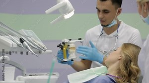 Pretty woman visiting her dentist in clinic