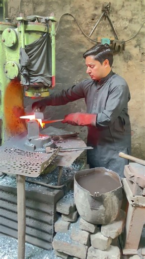 The Traditional Fire Forging of Iron Tools by Blacksmith