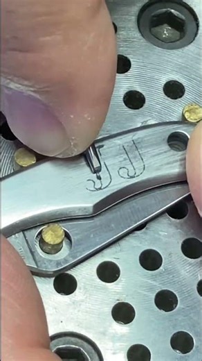 Lettering on a #spyderco Bug. #engraving #handengraving “lettering