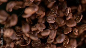 Super Slow Motion Shot of Exploding Coffee Beans on Black Background at 1000fps. Filmed on High Speed Cinematic Camera. Stock Video