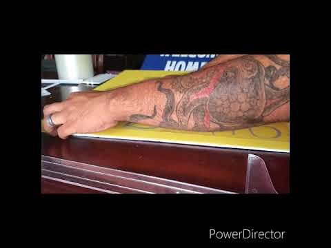 Applying adhesive vinyl to foam boards