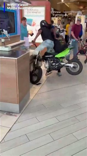 Dirt bike speeds through mall