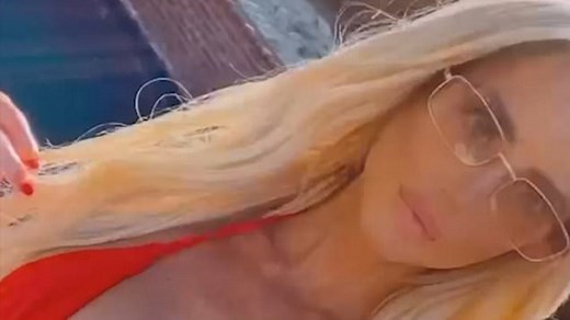 Selling Sunset star Emma Hernan poses in a red bikini