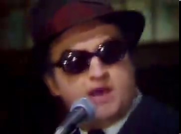On this day in 1978, John Belushi and Dan Aykroyd debuted as the Blues Brothers on Saturday Night Live. Dan Aykroyd was a serious blues fan and introduced John Belushi to blues music backstage at SNL. The ‘Blues Brothers’ concept came together as a parody and tribute: two white guys fully committing to classic Black American blues and soul traditions.Their performances stood out because they weren’t just sketches, they were full-on musical numbers and the audience loved it. The Blues Brothers!