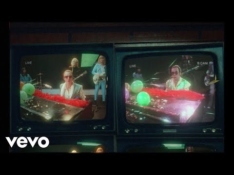 Cara Delevingne Transforms into Elton John in 'Step Into Christmas' Music Video Remake — Watch!