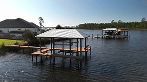 Aerial View Of Boat House Lifts On The Lake In Panama City Beach, Florida, USA. - orbit shot