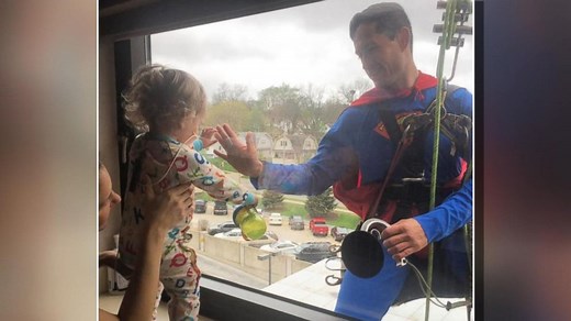 Superman visits tiny cancer patient at hospital window