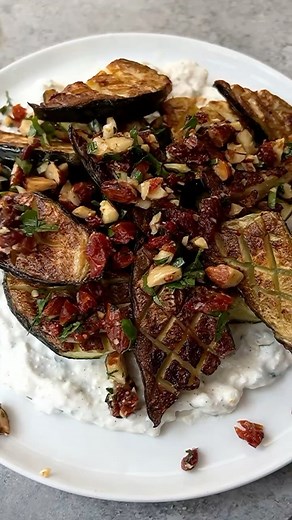 CRISP ROASTED ZUCCHINI WITH CREAMY FETA & SUN-DRIED TOMATO-ALMOND CRUMBLE. Before zucchini season officially ends, I had to re-share this one from a couple months back! • For the zucchini: 2 large zucchini, scored and cut into 2 inch pieces Seasoned salt or sea salt 2 tbsp olive oil • For the spread: 1/2 cup crumbled feta cheese 1/2 cup Greek yogurt or sour cream 2 tbsp chopped parsley or scallions 1 clove minced garlic Juice of 1/2 lemon 1/4 tsp salt • For the crumble: 3 tbsp chopped sun-dried 