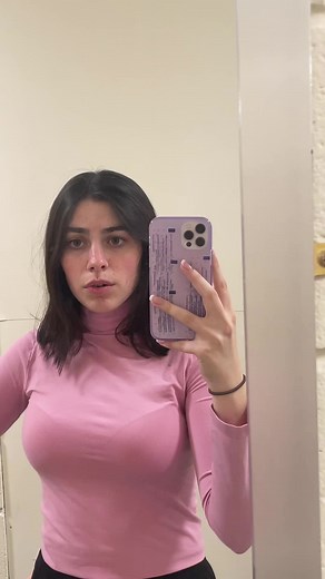 Mirror Selfies in Pink Long Sleeve Top and Black Pants