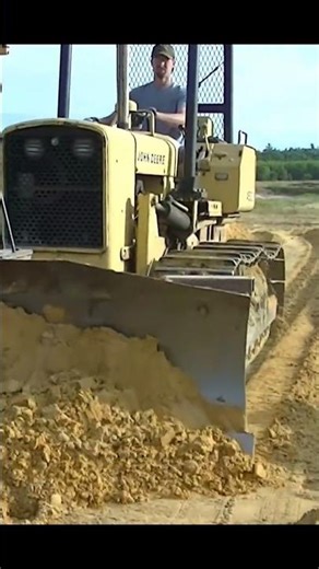 John Deere 450C Pushing Sand
