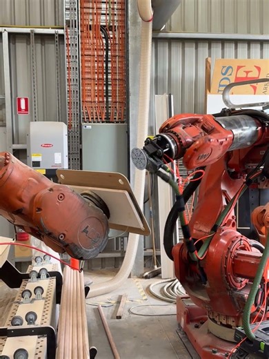 ABB robot dance partners sanding plywood shelves ￼