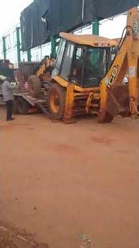 How to load a back hoe on low bed