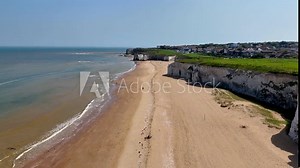 Botany Bay Beach in Broadstairs, Kent. Drone footage of the beach, bay, sea and chalk cliffs. Filmed on a sunny day in May.