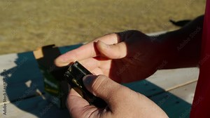 close-up of hand loading bullets in a gun magazin