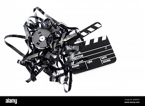 Movie clapper board with video tape on white background Stock Photo - Alamy