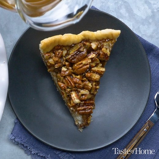 This is the ULTIMATE fall dessert... actually it's delicious any time of the year! Get the recipe for Caramel-Pecan Cheesecake Pie: https://trib.al/3VAjqIc | Taste of Home