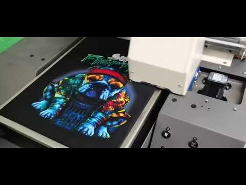 DTG printer directly print on cotton T-shirt and garments. No film, more save.