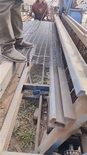 Building a steel grating floor.