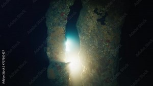 Cave freediving. Freediver swims underwater and explores intricate labyrinths of the cave in the West Papua, Indonesia