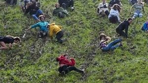 Cheese rolling contestants take on Cooper's Hill
