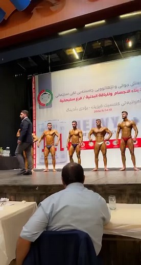 Bodybuilding Competition Featuring Muscular Male Competitors