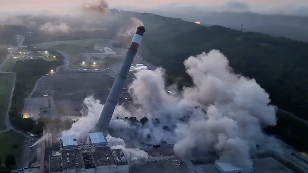 Power plant chimneys demolished in controlled blast