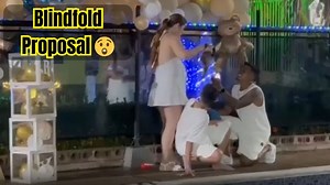 Blindfolded girl sees a proposal when she uncovers her eyes