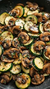 Zucchini sliced and sautéed. Season with salt, pepper, garlic. Cook in a hot skillet for 10 minutes until tender, savory, and lightly golden. Ingredients ➤ 1–3 tbsp olive oil ➤ 2 small zucchini, cut into thin half-moon slices ➤ Salt and black pepper, to taste ➤ 1 small yellow onion, finely diced ➤ 1 lb button mushrooms, cleaned and patted dry ➤ 3–4 cloves garlic, minced FULLL Recipe in First Cօʍʍеոτ 👇👇 | Nessy Recipes