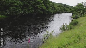 A man fly fishing for salmon on the River Orchy, Argyll, Scotland