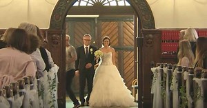 Bride starts walking down the aisle, stupefies the groom when she pulls out a mic