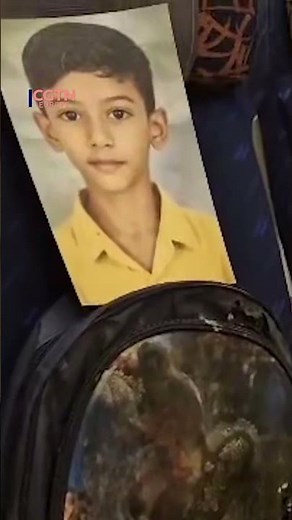 Iranian delegation carries photos of student victims on flight
