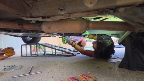 Driver shocked to find 8ft python hiding under car
