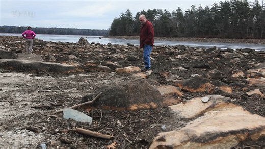 Four generations of Gene Larrow’s family have learned to swim on Old Killingly Pond. Just three short months ago talking from the shore Larrow would have been pointing to 120 acres of idyllic, clear blue water that swimmers, boaters, anglers, kayakers and wildlife enjoyed for decades. Instead, he was pointing at two large stones in a muddy, craggy wasteland. The pond, which straddles the border of Connecticut and Rhode Island, has lost more than 12 feet of water since the private land owners ope