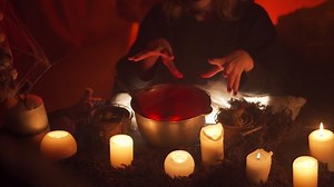 clip-1081010120-teenage-girl-dressed-witch-casts-spell-over