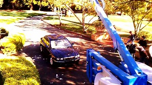 Bowling ball size hail falling on a 2007 Jaguar.