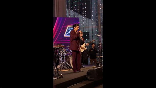 Humanoid robot joins crowd watching pop band... and even waves its arms