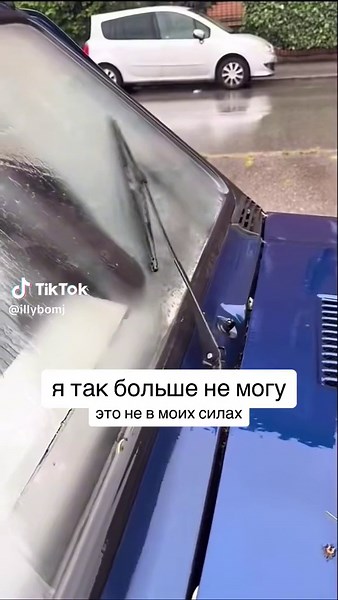 Close-Up of Windshield Wiper Action on Rainy Day