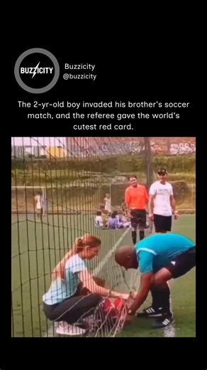 @buzzicity on Instagram: "This X post features a resurfaced 2023 video from a youth soccer match in Brazil, where a toddler wearing a red kit wanders onto the field during play. Rather than reacting sternly, the referee responds with humor, gently “ejecting” the child using a red card and turning the interruption into a light moment. The clip gained over 554,000 views and 12,000 likes in under 24 hours. Originally shared across platforms like Reddit and Facebook in August 2023, the video continu
