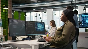 Female technician writing code on PC, developing neural networks APIs. System administrator using computer to troubleshoot software errors with artificial intelligence technology, camera A