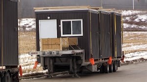 Construction of micro-shelter community for homeless Londoners shifts into high gear with arrival of cabins